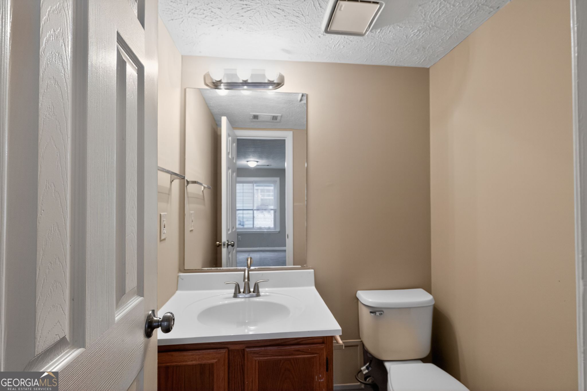 3751 Oakwood Manor Court Decatur, GA 30032 - Photo 32 of 33 a bathroom with a sink toilet and mirror