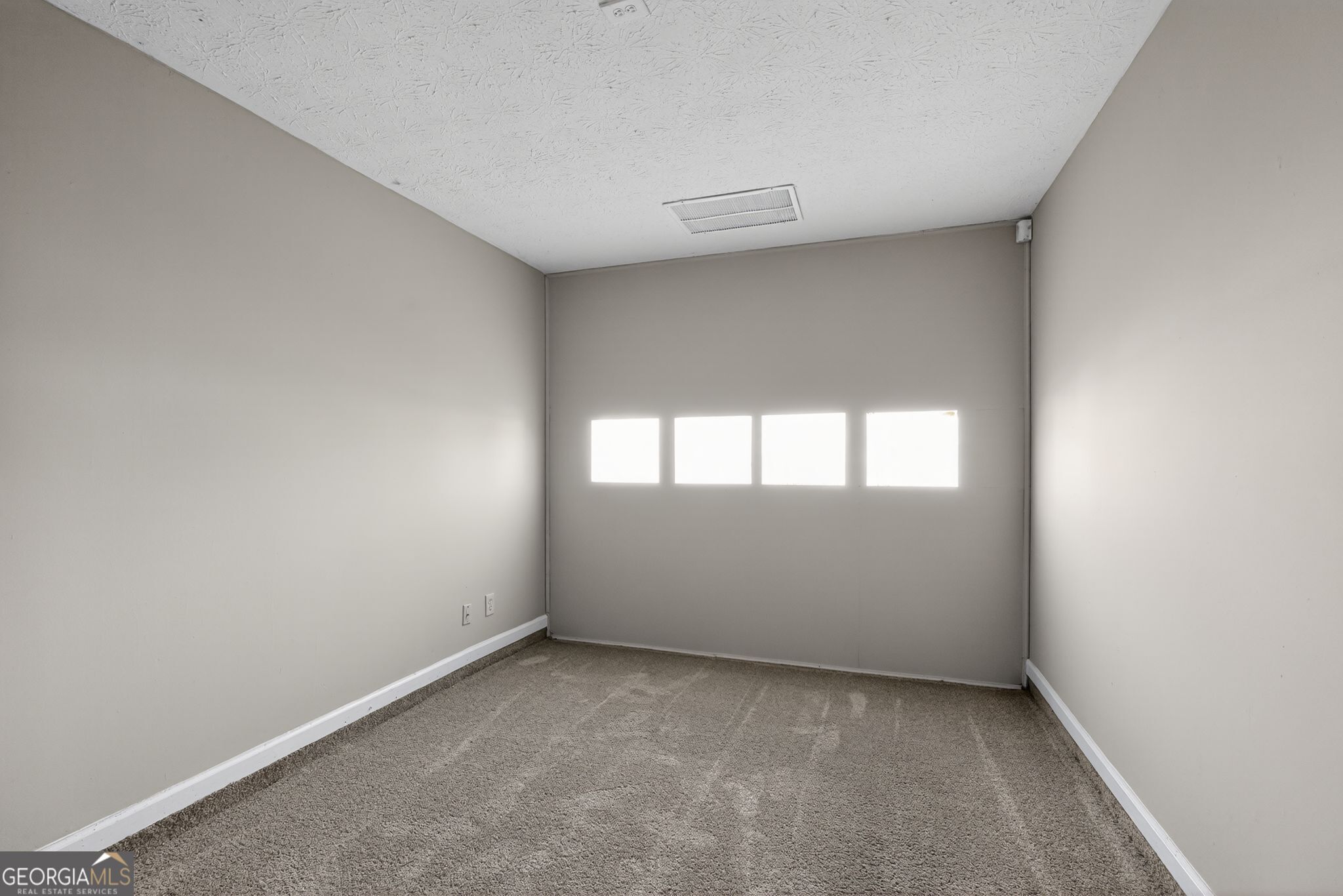 3751 Oakwood Manor Court Decatur, GA 30032 - Photo 8 of 33 an empty room with a window