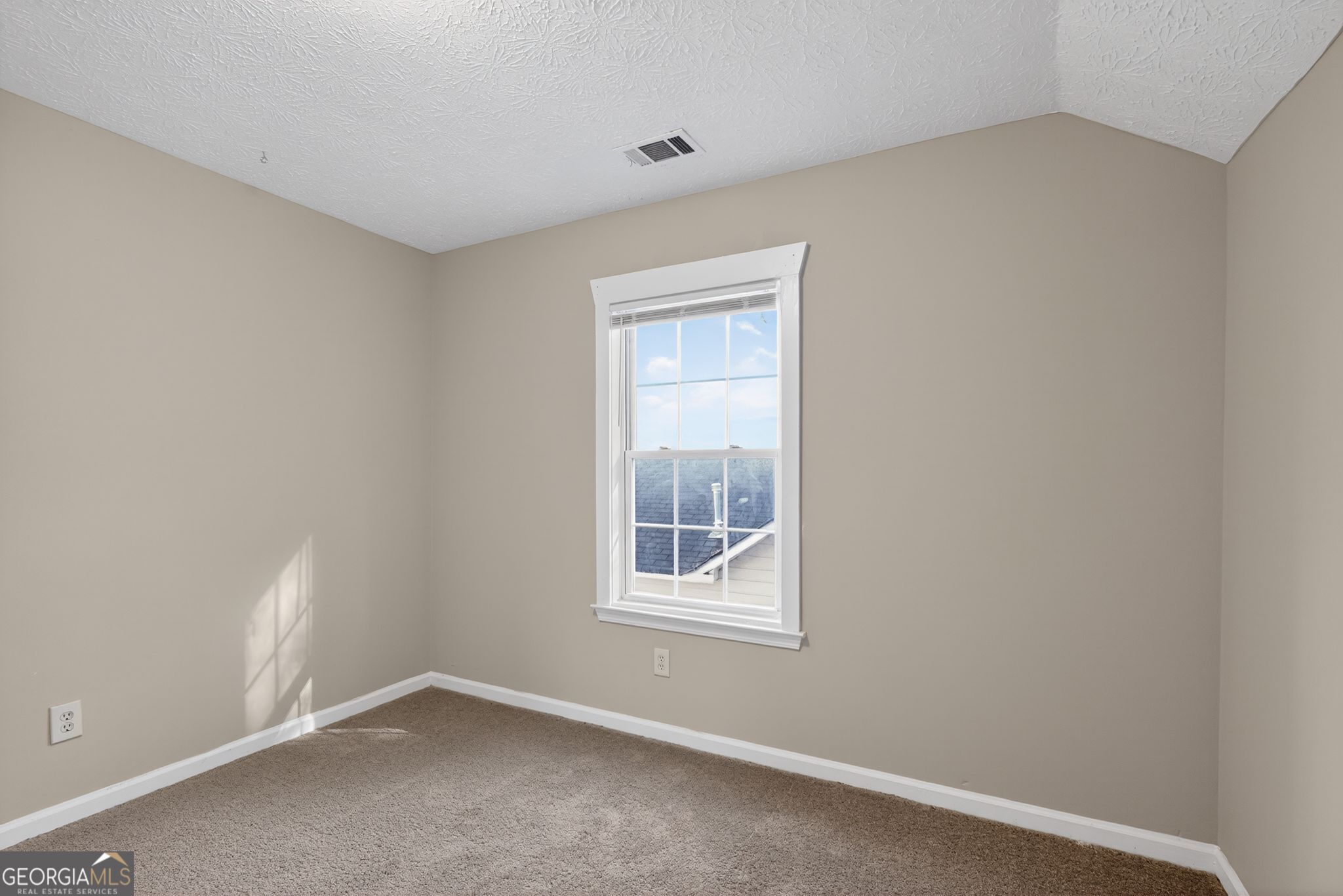 3751 Oakwood Manor Court Decatur, GA 30032 - Photo 9 of 33 a view of an empty room with a window