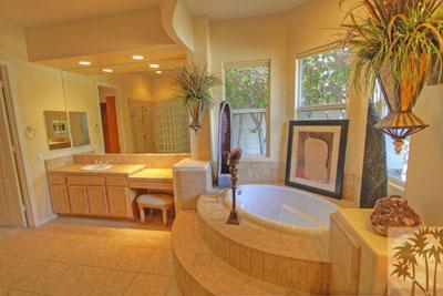 21 Bellisimo Court Rancho Mirage, CA 92270 - Photo 14 of 25 a spacious bathroom with a tub sink and mirror