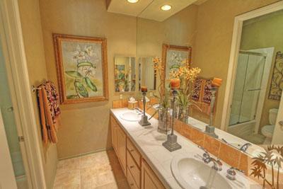 21 Bellisimo Court Rancho Mirage, CA 92270 - Photo 18 of 25 a bathroom with double vanity sink and a mirror