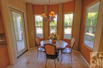 21 Bellisimo Court Rancho Mirage, CA 92270 - Photo 2 of 25 a view of a dining room with furniture a chandelier and wooden floor