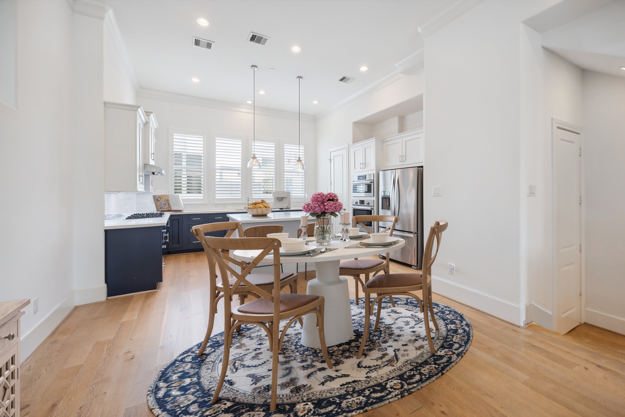 2714 Harvard Street Houston, TX 77008 - Photo 14 of 33 Plan your next dinner party in the centrally located dining area, surrounded by the kitchen, living room and staircase.