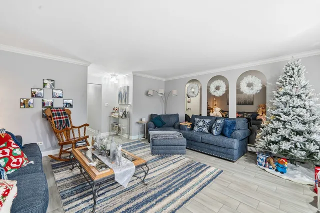 a living room with fireplace furniture and decor