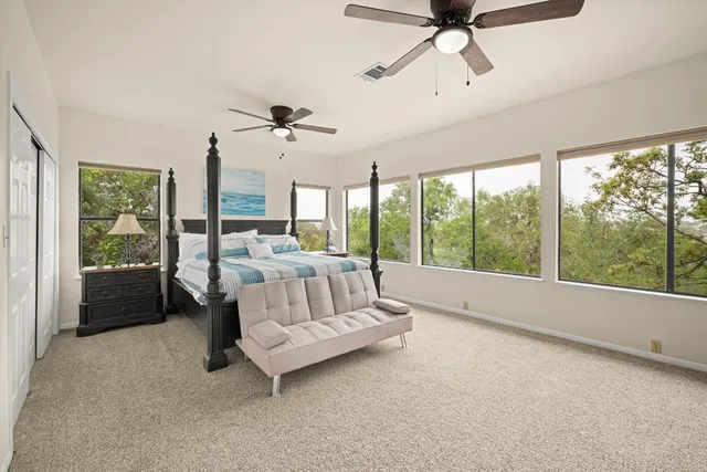 a bed room with a bed and a balcony