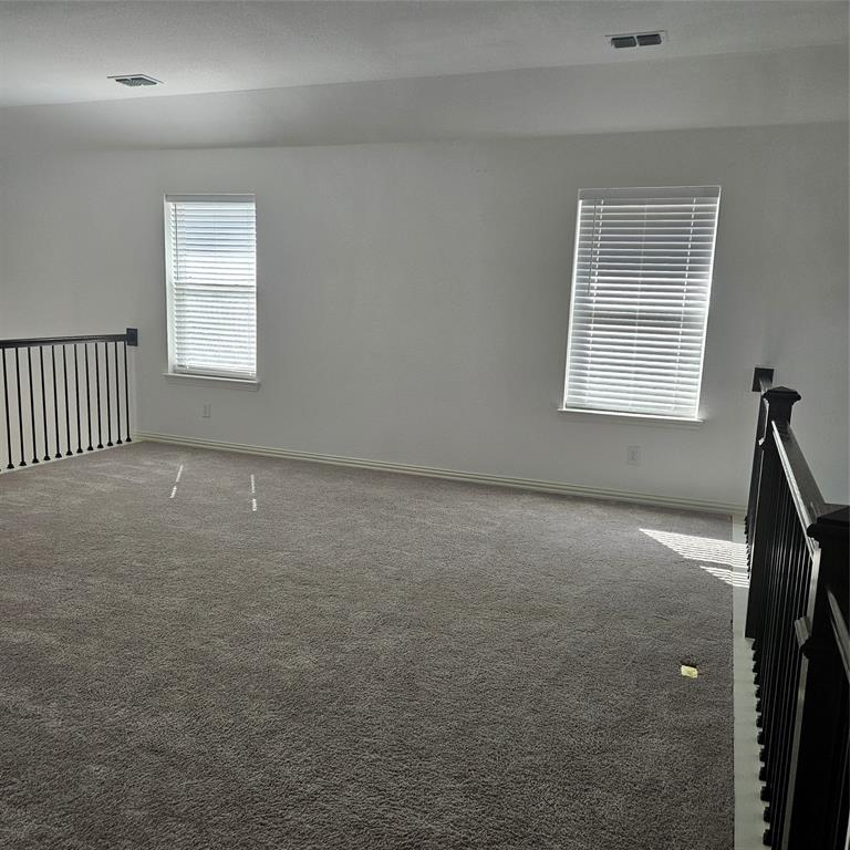 2309 Jack Rabbit Way Northlake, TX 76247 - Photo 25 of 28 Open loft space with grey carpet flooring