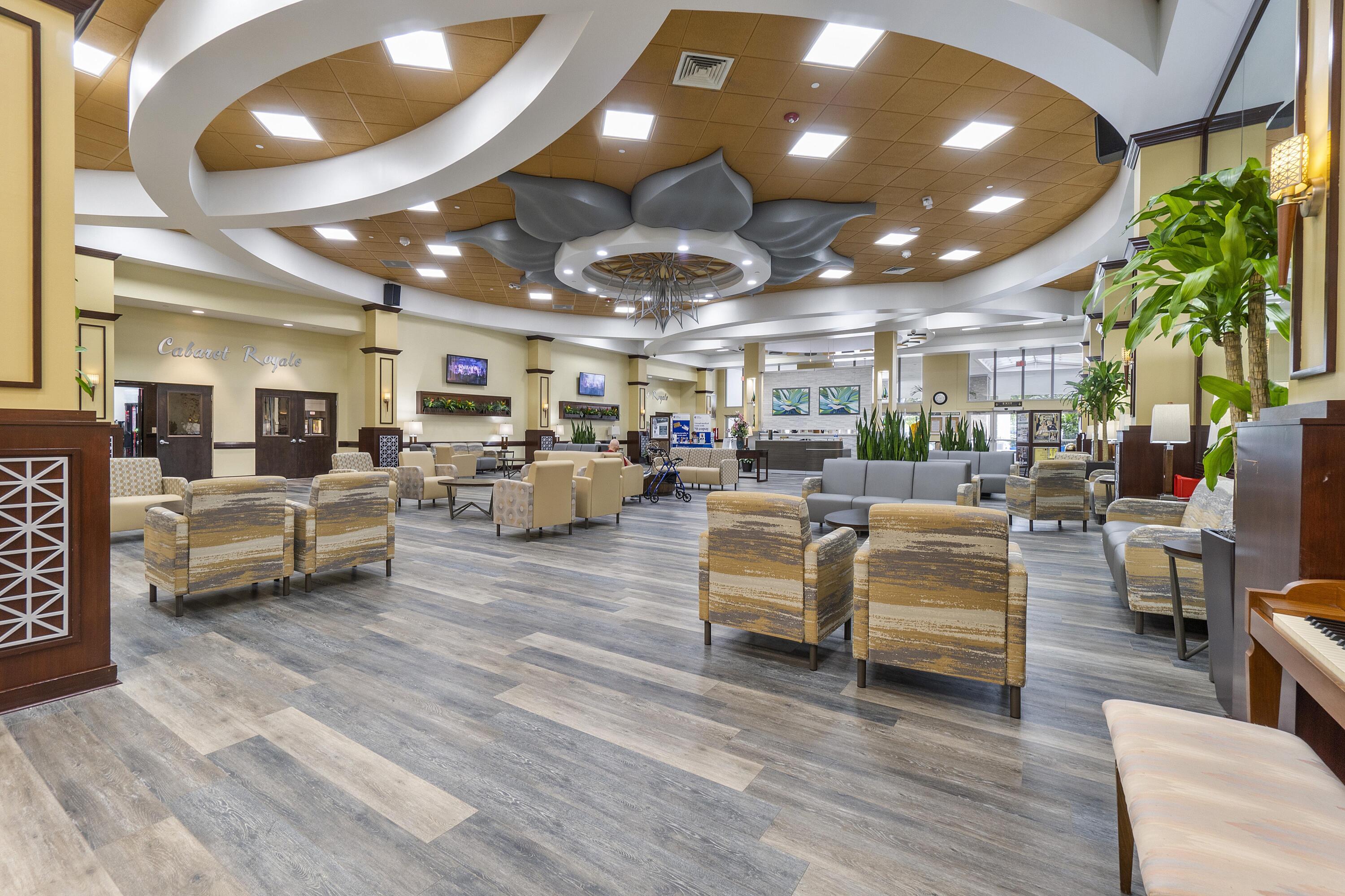 9705 Malvern Drive Tamarac, FL 33321 - Photo 2 of 29 a living room with lots of furniture and a chandelier