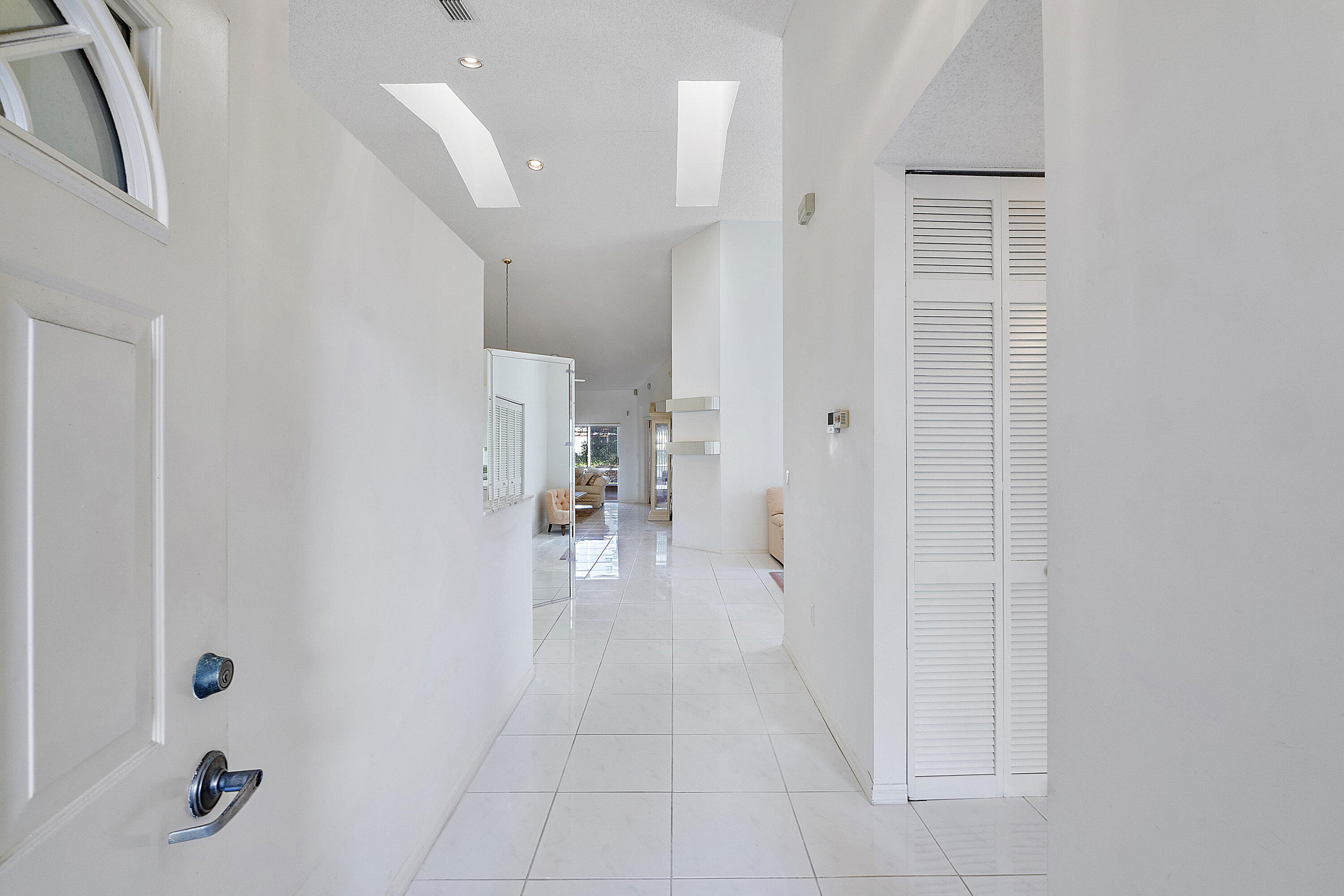 9705 Malvern Drive Tamarac, FL 33321 - Photo 10 of 29 a view of a hallway with closet and a livingroom view