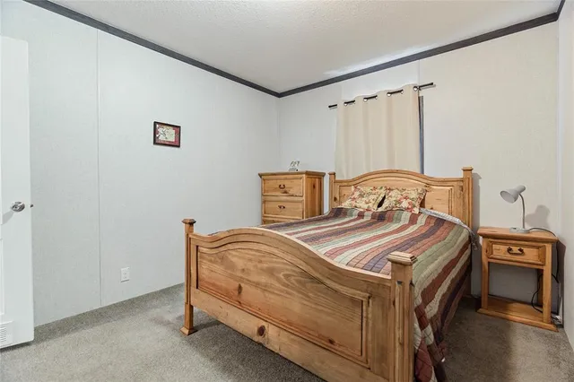 a bedroom with a bed and a cabinets