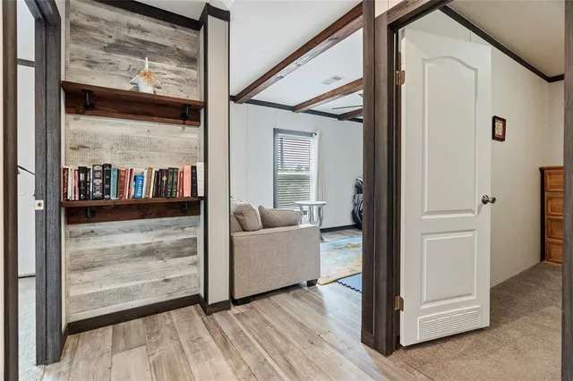 a view of front door and porch with wooden floor