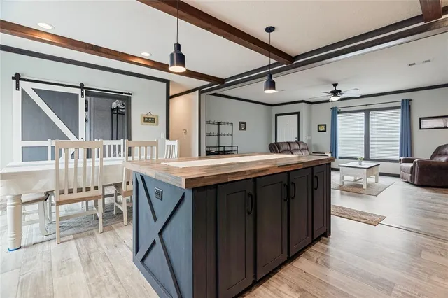 a kitchen with a sink stove and wooden cabinets