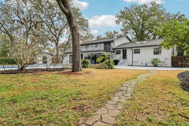 a backyard of a house with lots of green space
