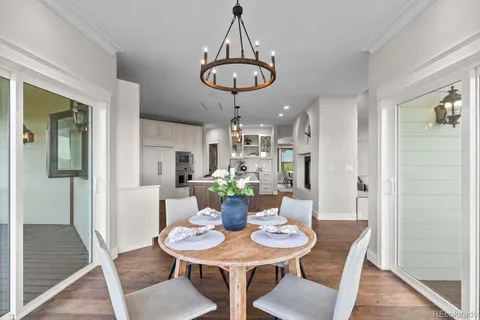 a view of a hallway to dining room and wooden floor