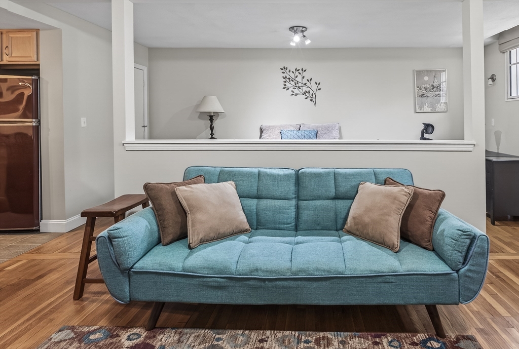64 Commonwealth Avenue, Unit G1 Boston, MA 02116 - Photo 4 of 12 a living room with furniture