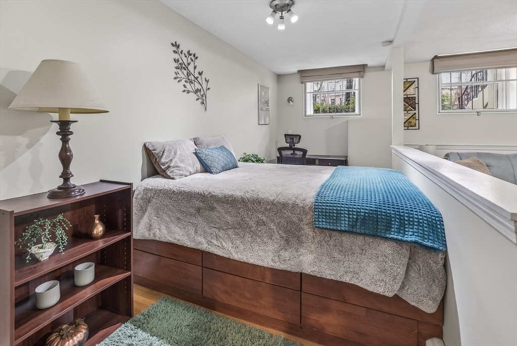64 Commonwealth Avenue, Unit G1 Boston, MA 02116 - Photo 7 of 12 a bedroom with a bed and a window