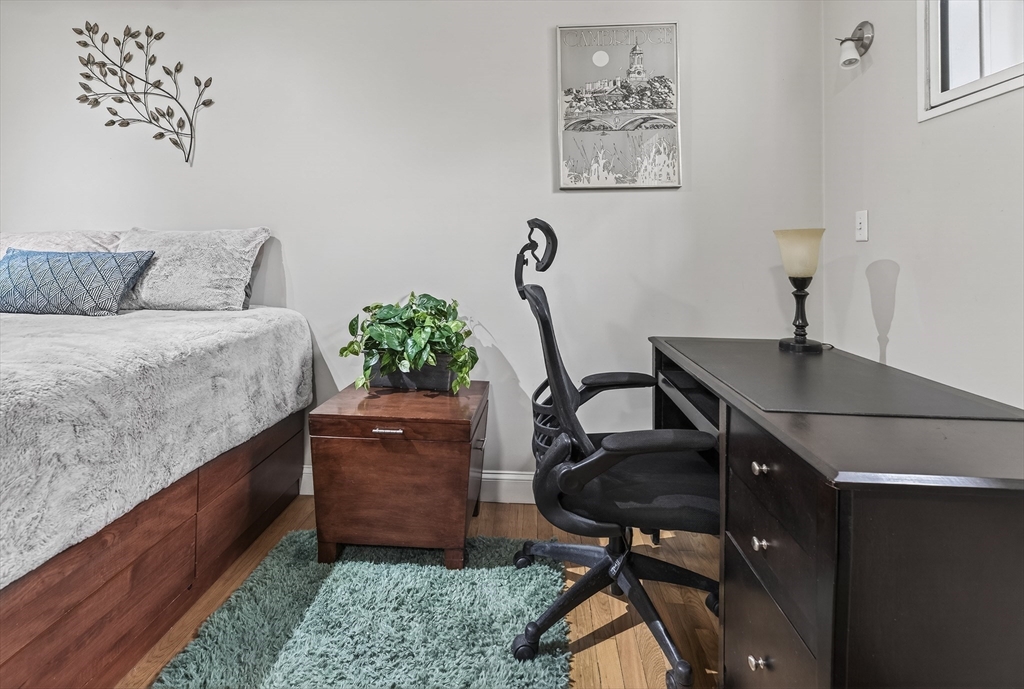 64 Commonwealth Avenue, Unit G1 Boston, MA 02116 - Photo 8 of 12 a workspace with furniture and window
