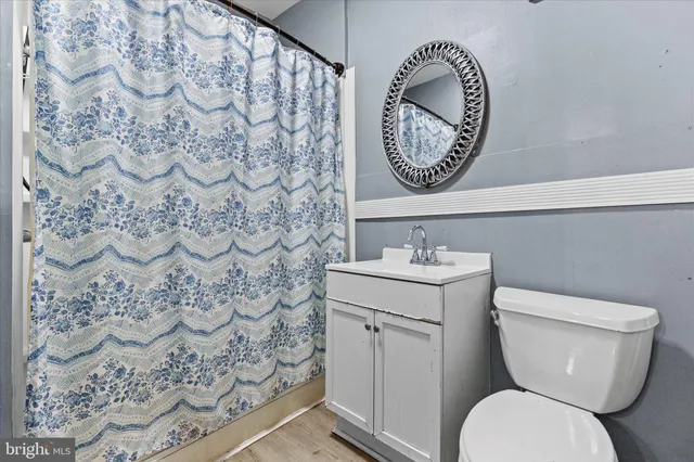 a bathroom with a toilet and a sink