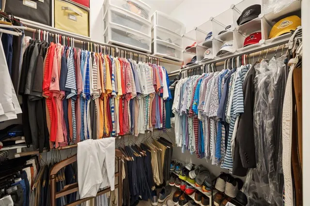 a bathroom with a double vanity sink a mirror and a bathtub