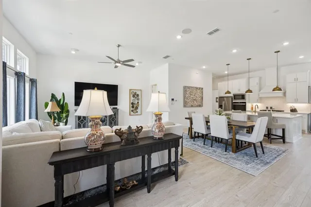 a view of a patio with table and chairs and wooden fence