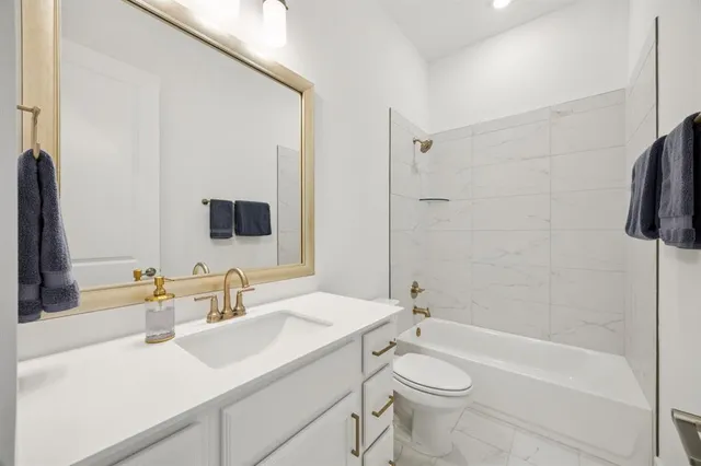a view of kitchen and kitchen with stainless steel appliances