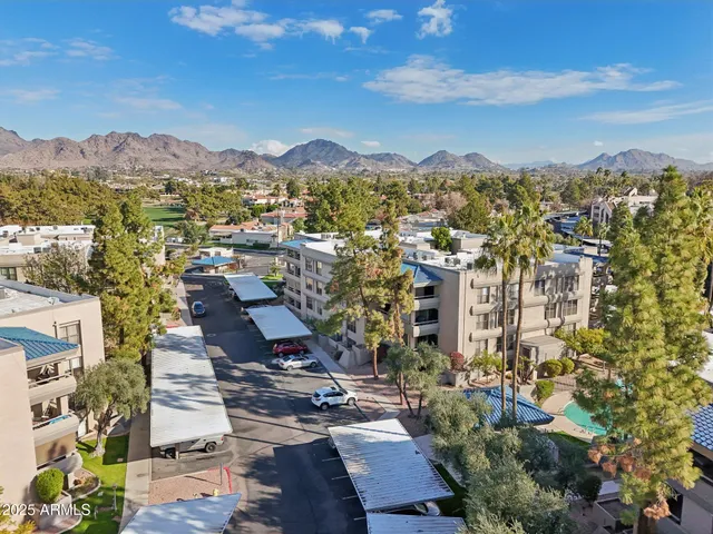 a view of a city with mountains in the background