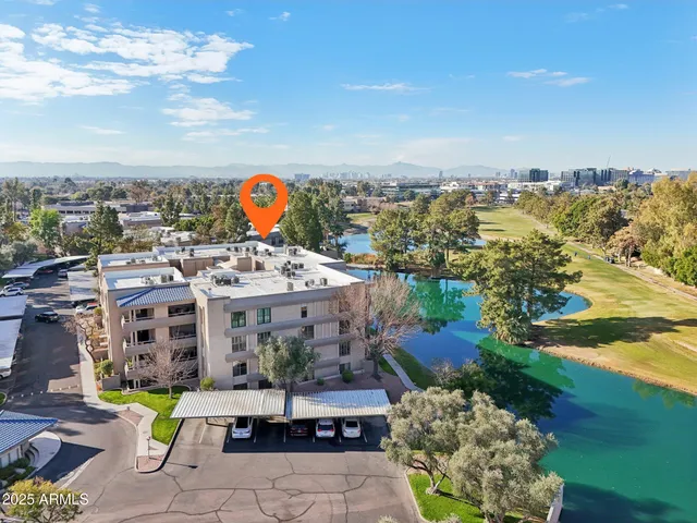 a view of a swimming pool with a table and chairs