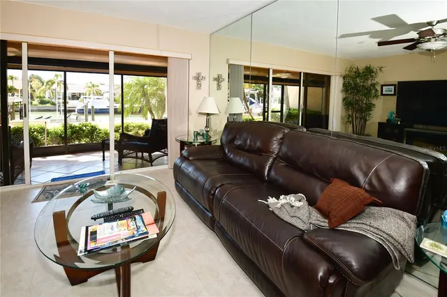a kitchen with a sink a counter top space and stainless steel appliances