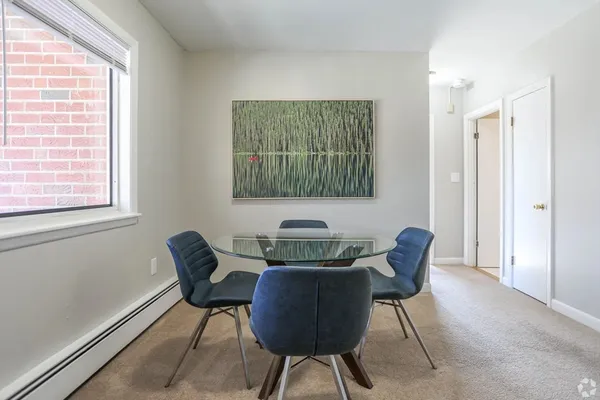 a view of a room that has a couch and a chair in it