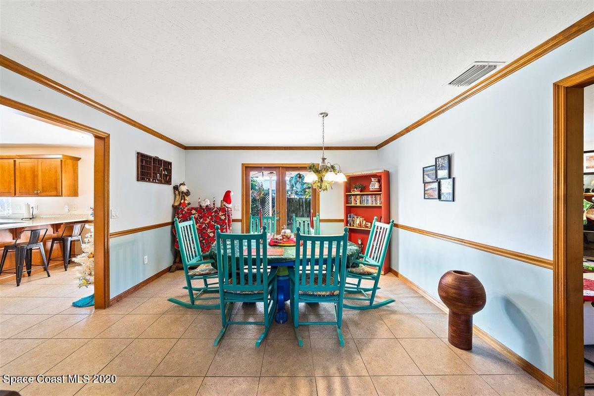 145 Richards Road Melbourne Beach, FL 32951 - Photo 15 of 53 a view of a dining room with furniture and a potted plant
