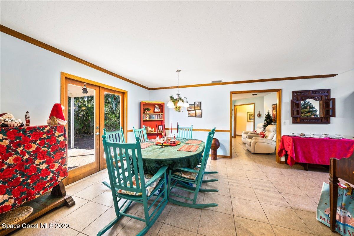 145 Richards Road Melbourne Beach, FL 32951 - Photo 18 of 53 a dining room with furniture and wooden floor