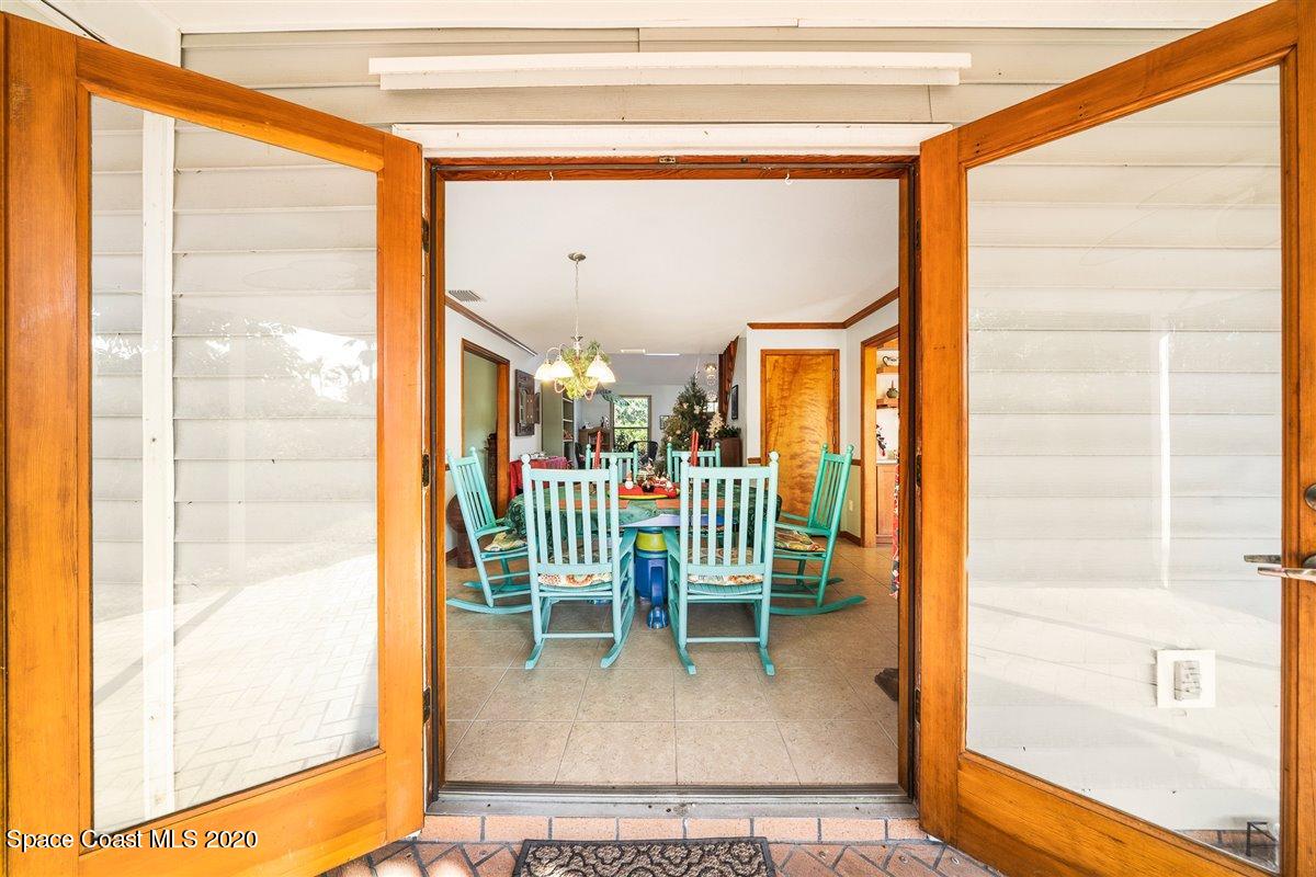145 Richards Road Melbourne Beach, FL 32951 - Photo 19 of 53 a view of entryway and hall with a dining table