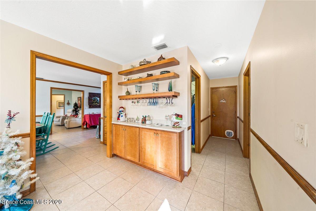 145 Richards Road Melbourne Beach, FL 32951 - Photo 25 of 53 a view of utility room and bedroom