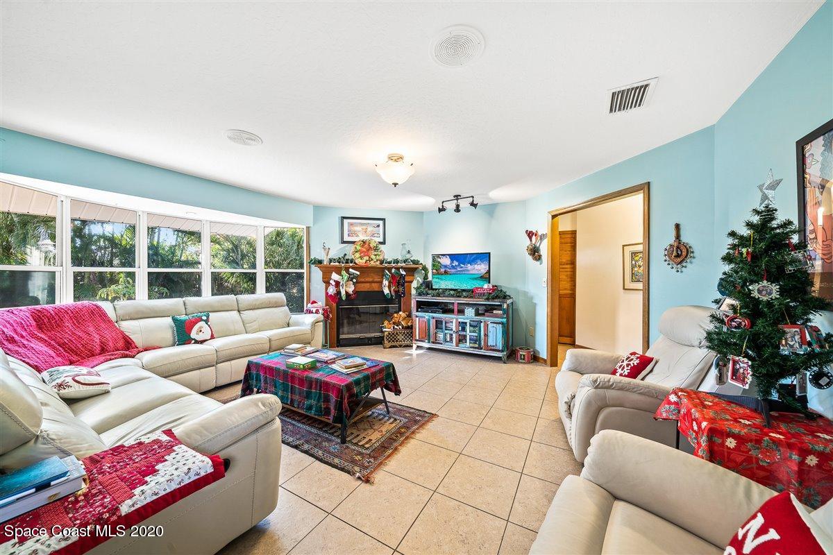 145 Richards Road Melbourne Beach, FL 32951 - Photo 28 of 53 a living room with furniture and a large window