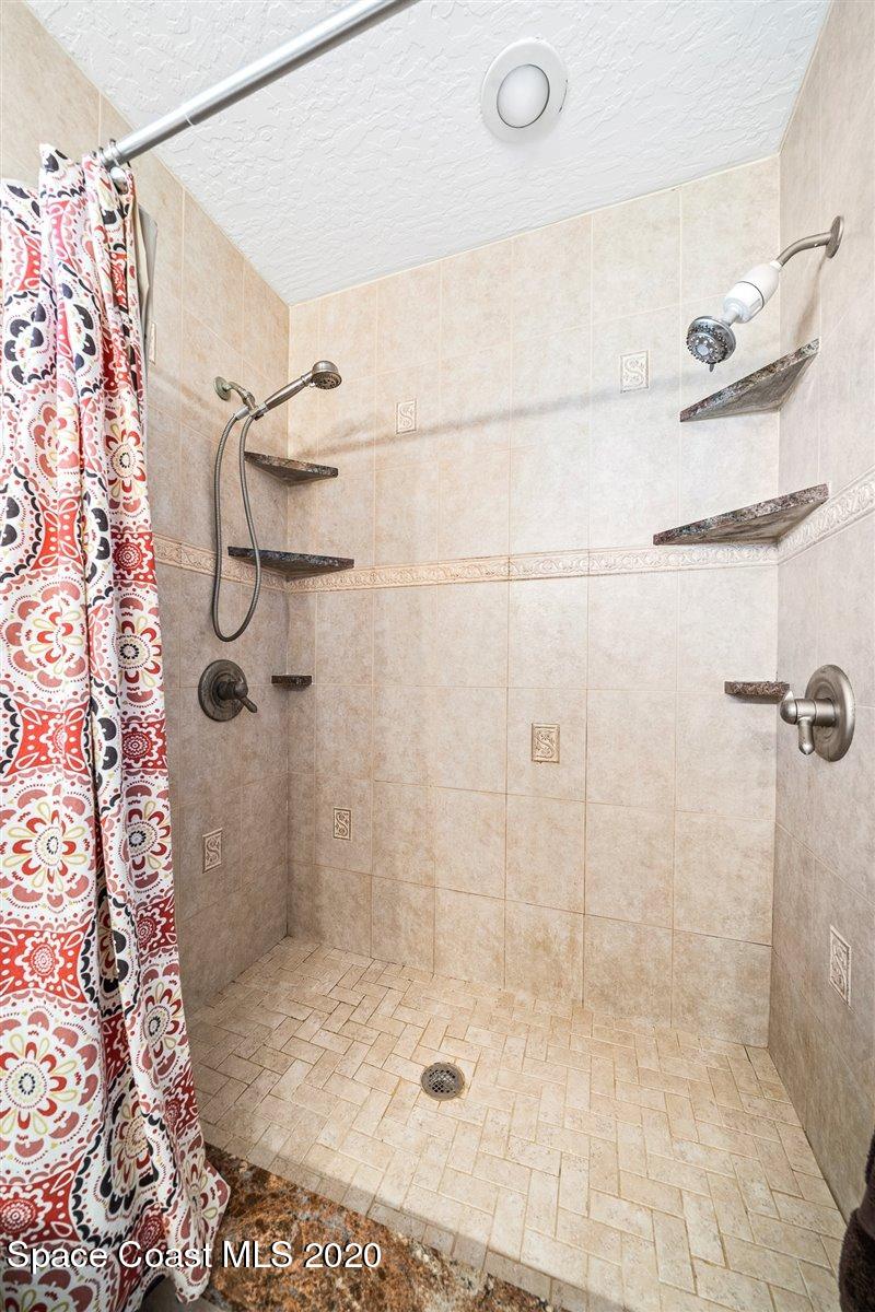 145 Richards Road Melbourne Beach, FL 32951 - Photo 34 of 53 a bathroom with a shower