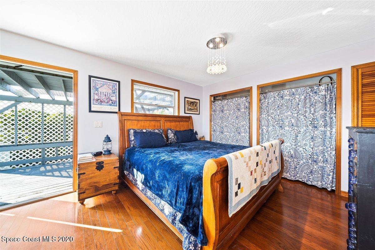 145 Richards Road Melbourne Beach, FL 32951 - Photo 35 of 53 a bed room with a bed and a window