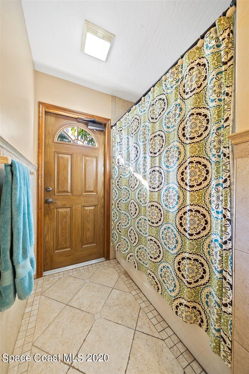 145 Richards Road Melbourne Beach, FL 32951 - Photo 43 of 53 a bathroom with a bathtub and shower