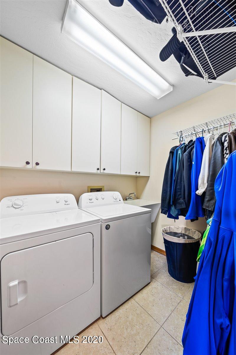 145 Richards Road Melbourne Beach, FL 32951 - Photo 47 of 53 a view of walk in closet with clothes and shoes