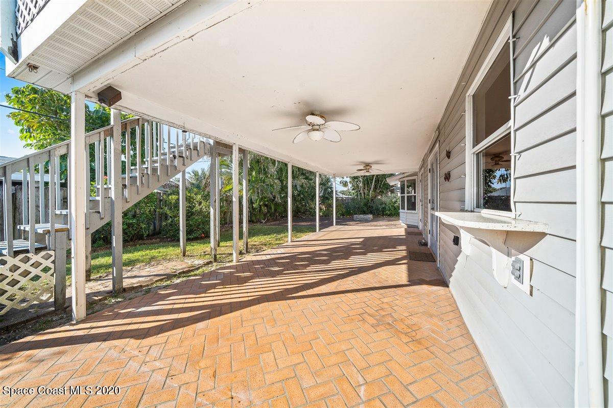 145 Richards Road Melbourne Beach, FL 32951 - Photo 50 of 53 a view of porch with a flat tv screen and a floor to ceiling window