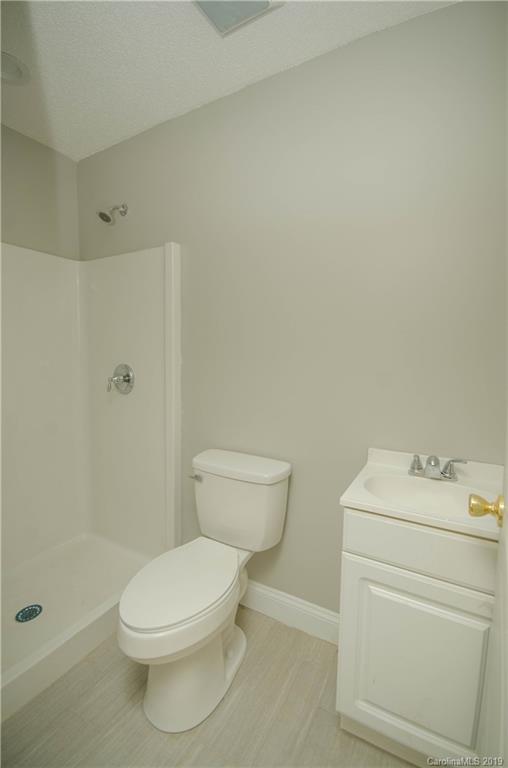 356 Old Pinckney Road York, SC 29745 - Photo 8 of 10 a white toilet sitting next to a bath tub shower