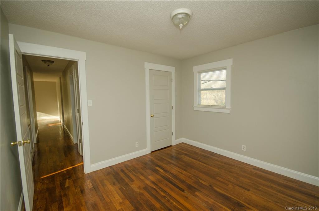 356 Old Pinckney Road York, SC 29745 - Photo 9 of 10 an empty room with wooden floor and windows