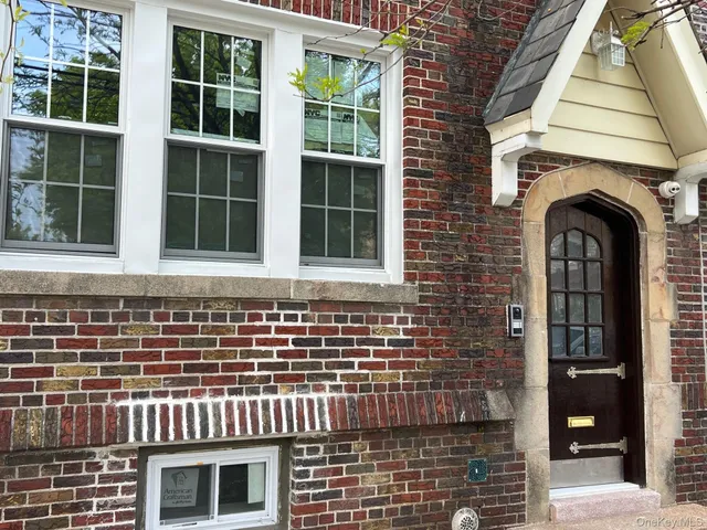 a front view of a house with a glass door