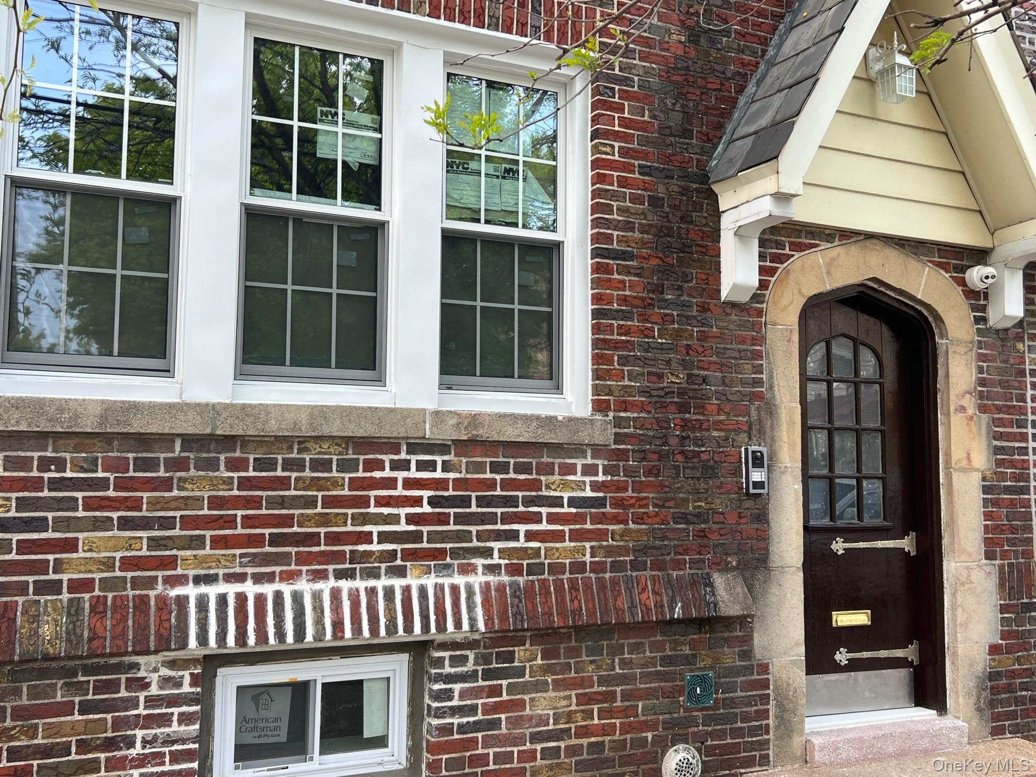 a front view of a house with a glass door