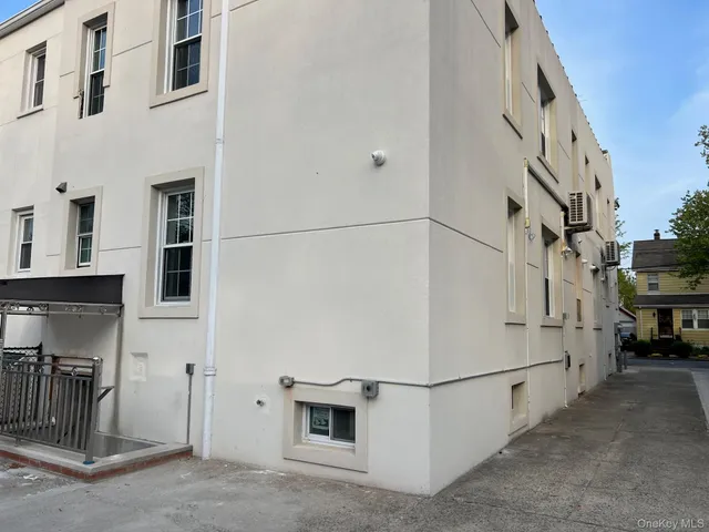 a view of a house with a street