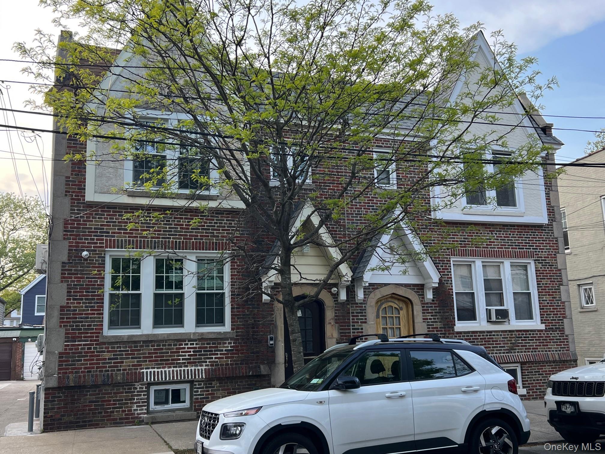 89-21 69th Road, Unit 2R Queens, NY 11375 - Photo 16 of 16 a front view of a house with parking space