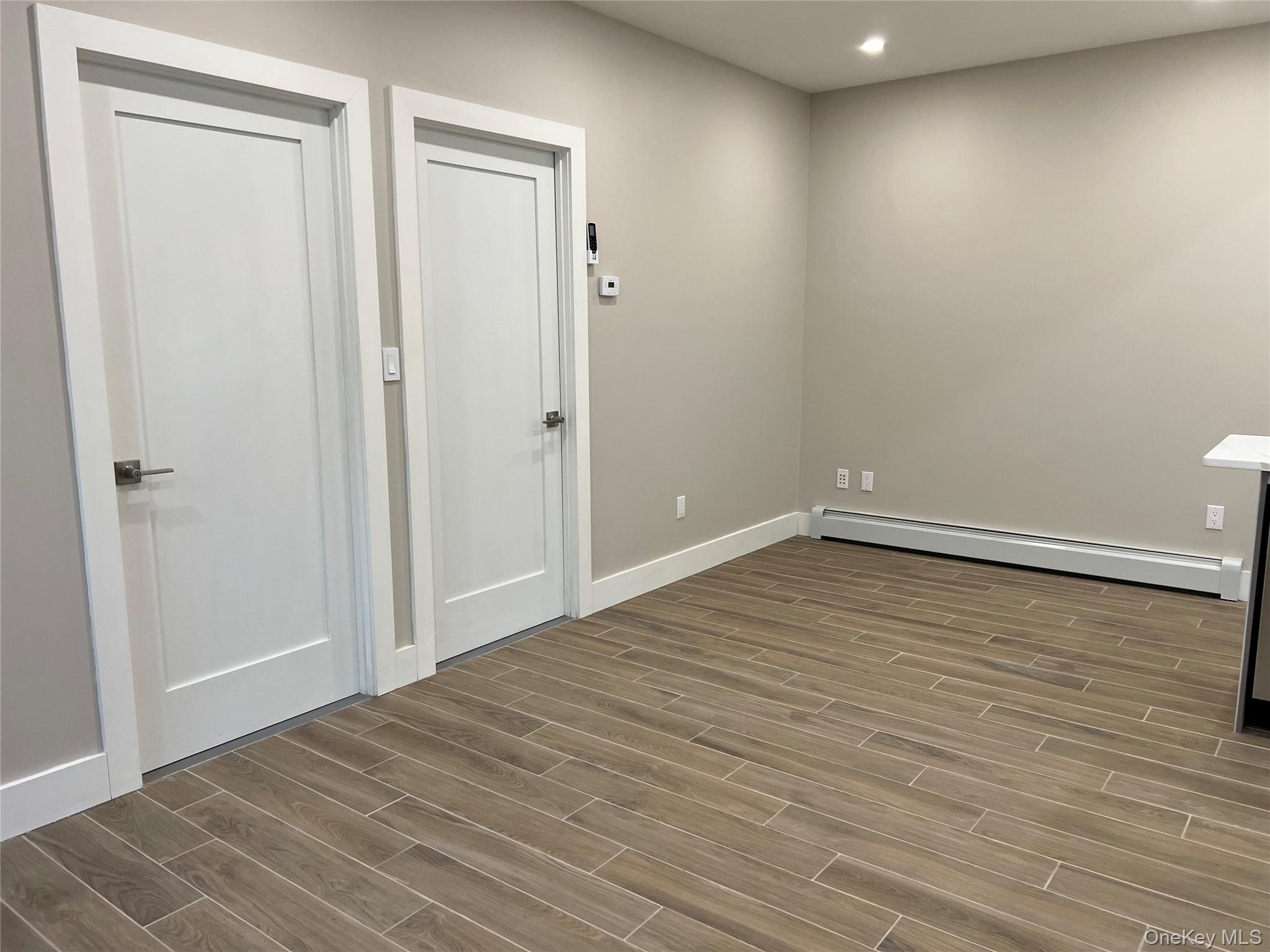 89-21 69th Road, Unit 2R Queens, NY 11375 - Photo 3 of 16 a view of room with wooden floor