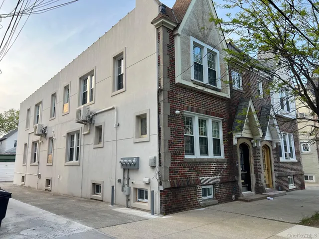 a front view of a building with a street