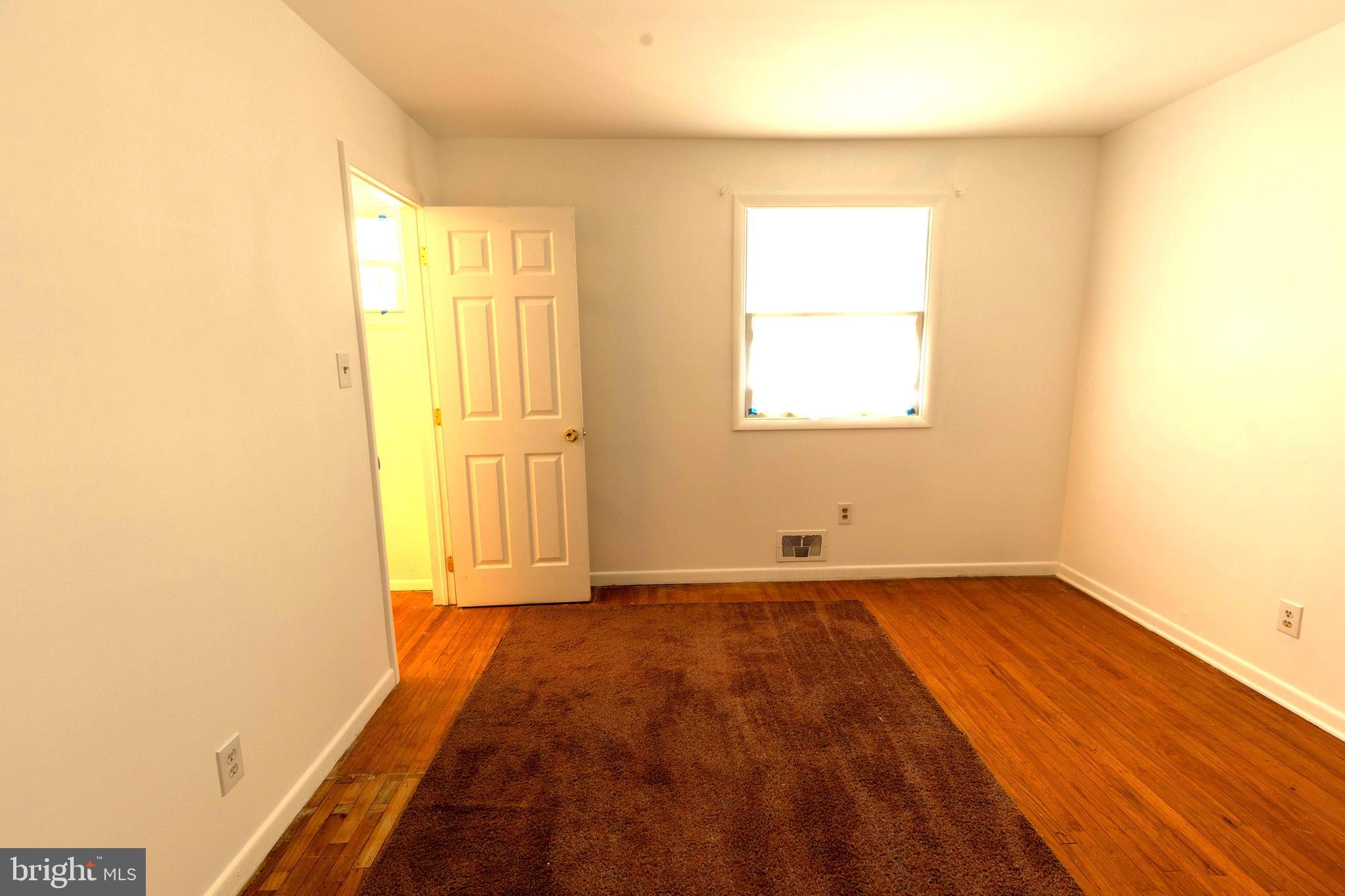 7 Lansdowne Road Burlington, NJ 08016 - Photo 8 of 8 a view of an empty room and window