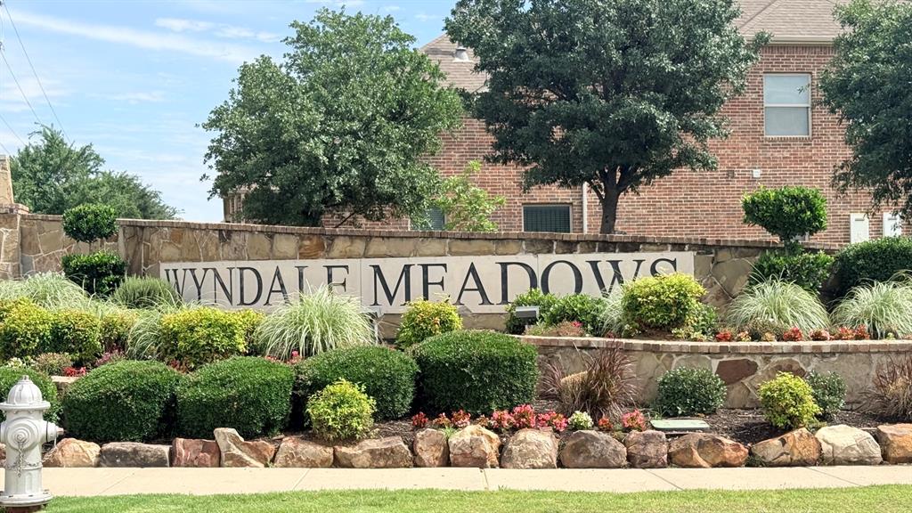 337 Prairie Ridge Lane Lewisville, TX 75056 - Photo 22 of 28 a view of a sign in front of house