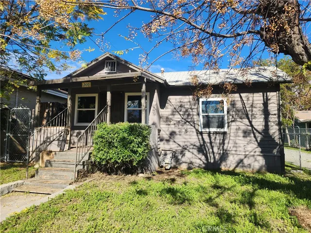 a view of a park with large trees
