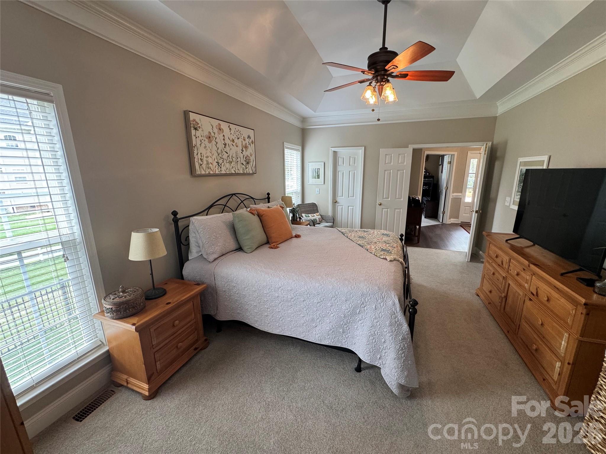 110 Burtons Barn Road Mooresville, NC 28115 - Photo 11 of 37 a bedroom with a bed and a television